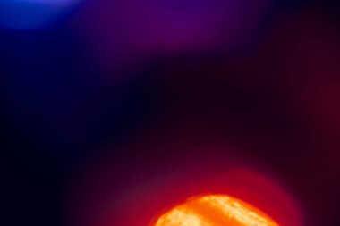 abstract lens flare on black background. blue, red, orange, purple, pink defocused bokeh lights. glowing color burst. bokeh abstract backdrop