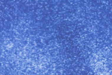 Parıltılı mavi bir arka plan. Soyut tatil arkaplanı.