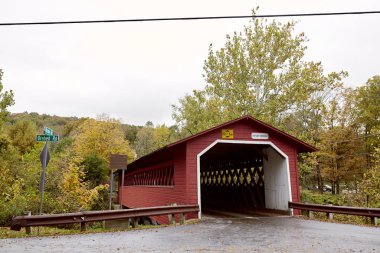 Burt Henry Covered Bridge on a cold, Fall day in the New England town of Bennington, Vermont clipart