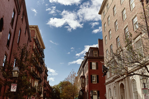Beautiful brick residential buildings on a Fall day, in the historic Beacon Hill neighborhood of Boston, Massachusetts