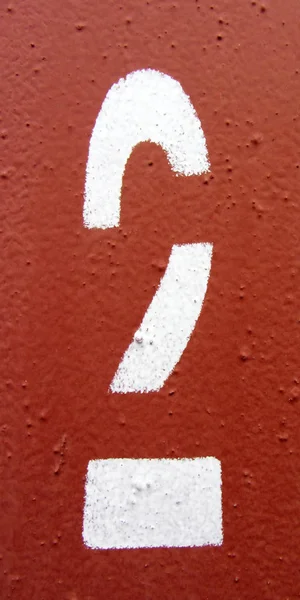 Number 2 white digit painted on rusty weathered red metal surface — Stock Photo, Image