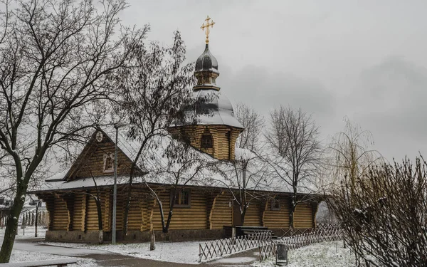 Orthodox tree Russian church covered with snow. Wooden Church Before Christmas