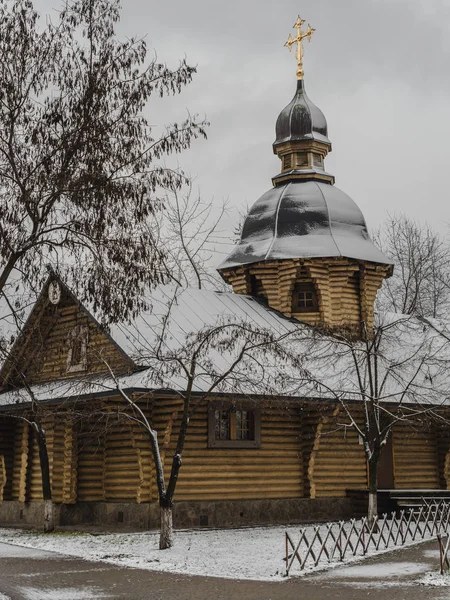 Orthodox tree Russian church covered with snow. Wooden Church Before Christmas