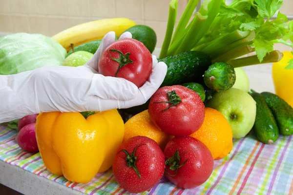 Washing fruits and vegetables after shopping from grocery store during Coronavirus Covid-19 quarantine period. Concept of safety, precautions, reinsurance during pandemic, new normal.