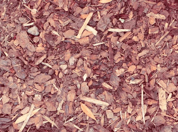 Close view on bark mulch, nature background in retro look — Stock Photo, Image