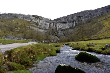Malham Cove in the Yorkshire Dales, it's famous  location for hiking and outdoor adventure clipart