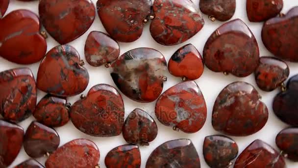 Brecciated jasper hearts turn around — Stock Video