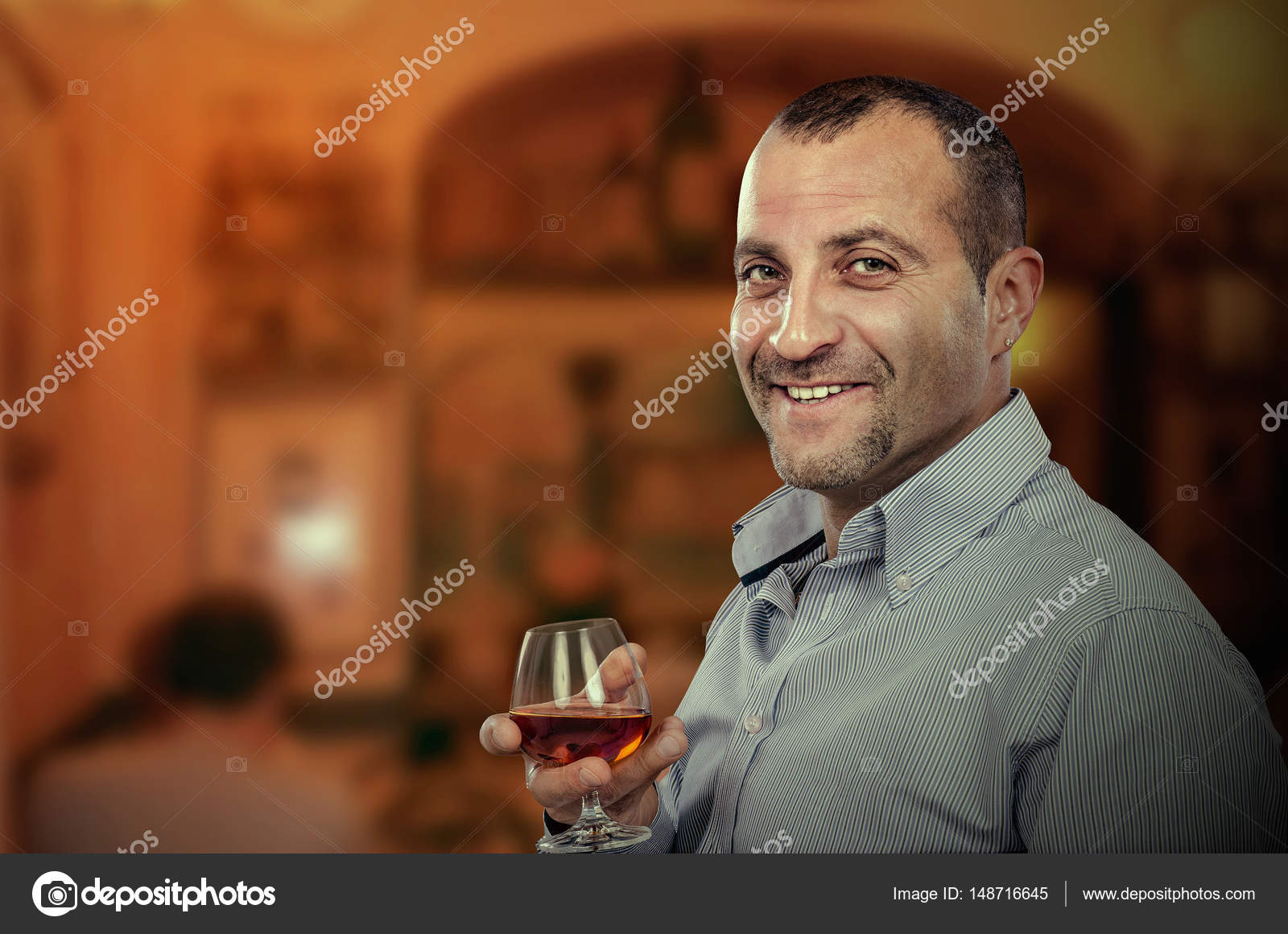 Smiling Adult Man Posing With Glass Of Brandy Stock Photo