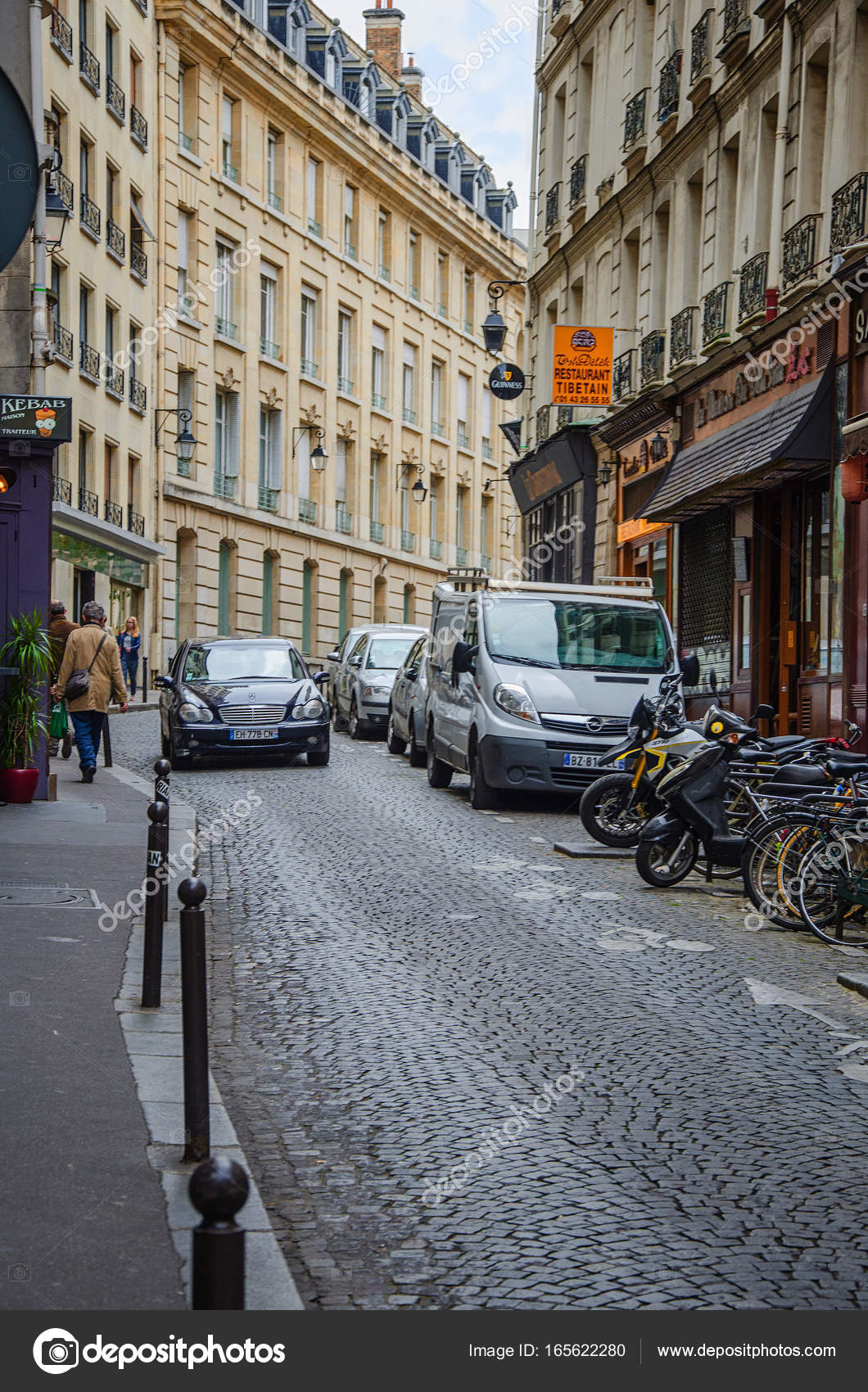 Cute cobblestone street in Paris Stock Editorial Photo © verbaska