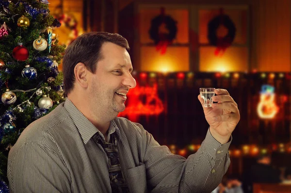 Cheerful mature man makes a toast to Christmas — Stock Photo, Image