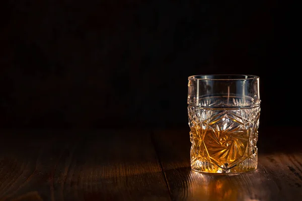 Whiskey in glass with ice — Stock Photo, Image