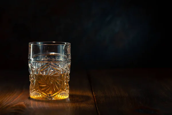 Whiskey in glass with ice — Stock Photo, Image