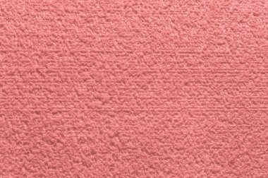 Pastel dokulu tekstil modayı arka plan ve duvar kâğıdı için pembe pastel yüzey