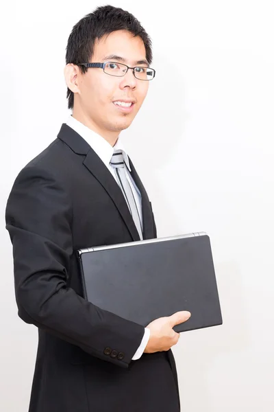 愉快的亚洲商业人与笔记本电脑 — 图库照片