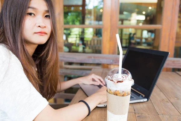 Beautiful hipster student woman using laptop at cafe — Stock Photo, Image