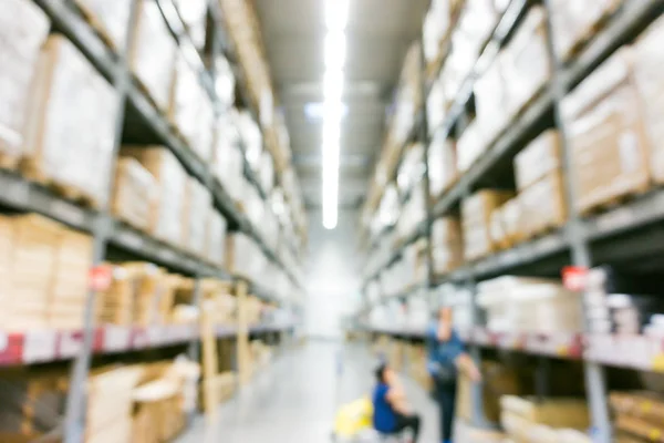 Blurred image of shelves in modern distribution warehouse store — Stock Photo, Image