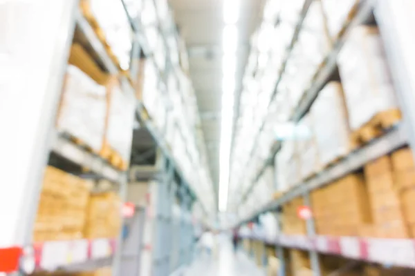 Blurred image of shelves in modern distribution warehouse store — Stock Photo, Image