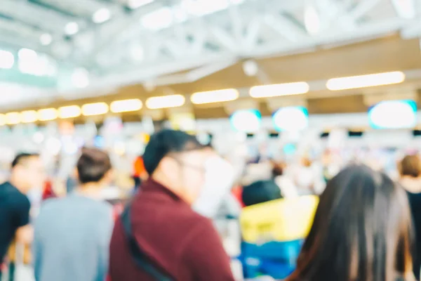 Blurred crowed passenger in airport waiting for check in
