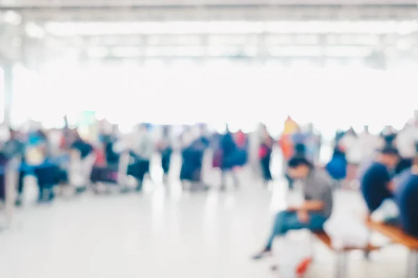 Blurred crowed passenger in airport waiting for check in