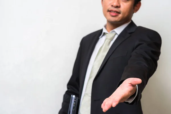 Hombre de negocios con portátil enviar la mano para usted —  Fotos de Stock