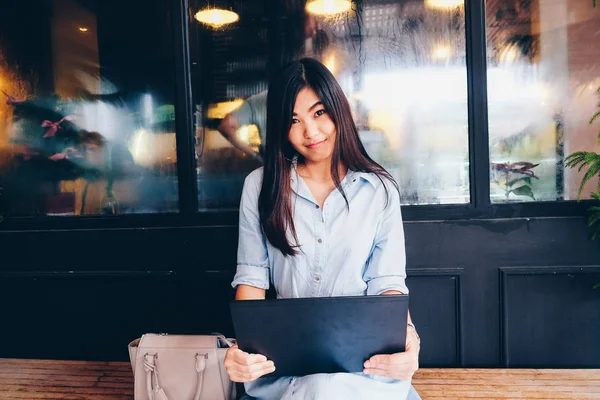 Happy young asian beautiful smiling women using laptop — Stock Photo, Image