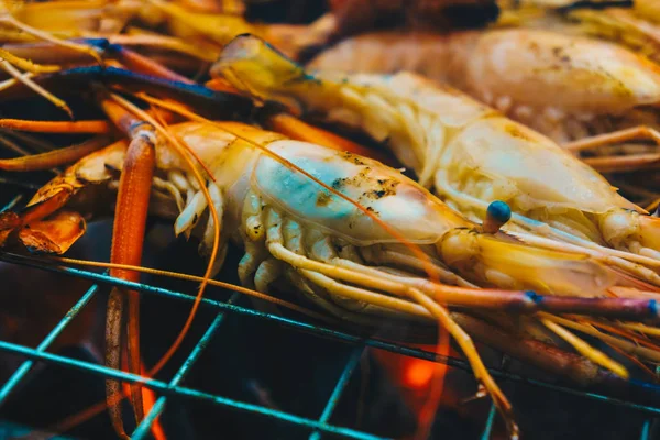 Delicious seafood prawn on grill with flames — Stock Photo, Image