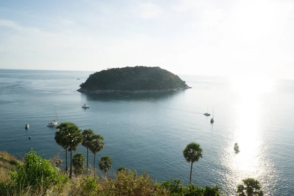 Paradise mountain sea coast Phromthep cape with yacht boat palm tree, Thailand