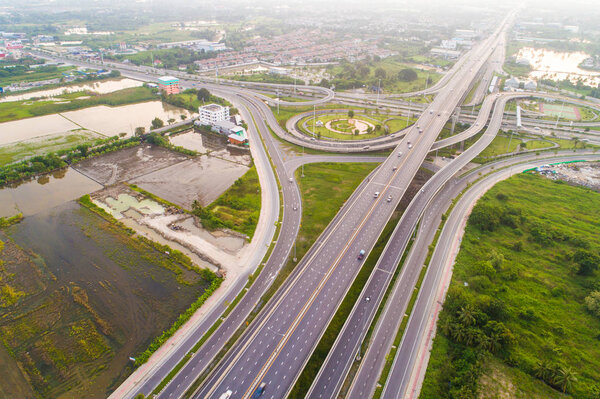 Overpas traffic intersection road topview with green tree in the morning, Transport concept