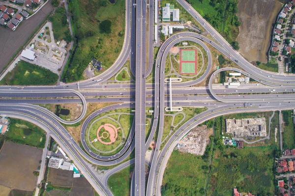 Intersection traffic circle road with car and green tree