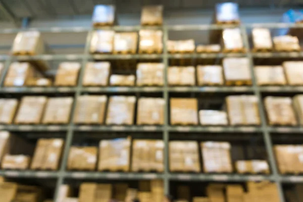 Blurred warehouse store box on shelf for industrial background