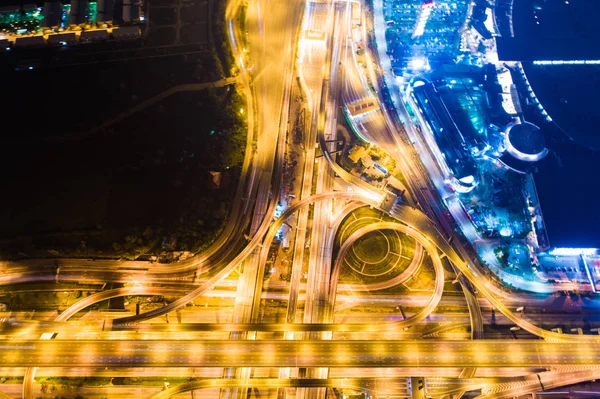 Night traffic intersection city road with vehicle movement