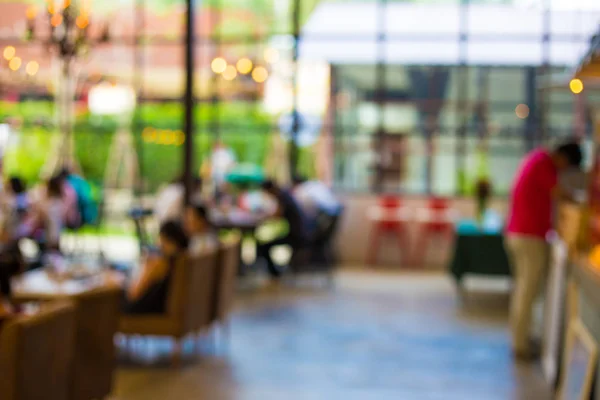 Blurred interior coffee shop with many people — Stock Photo, Image