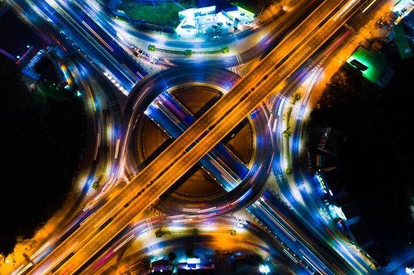 Traffic light on circular junction road long exposer shot aerial view