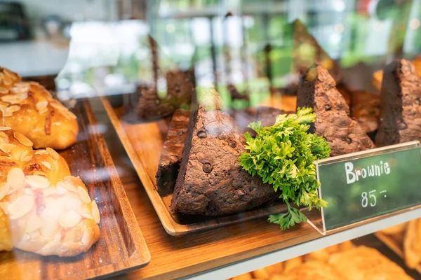 Various sweet bakery with sausage and chocolate in glass box of cafe