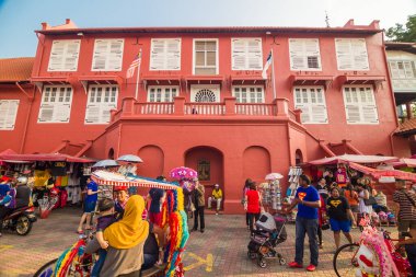 Malacca,Malaysia - October 24,2014: Scenic view of the Christ Church Malacca and Dutch Square, Tourist can seen exploring around. It has been listed as UNESCO World Heritage Site since 7/7/2008