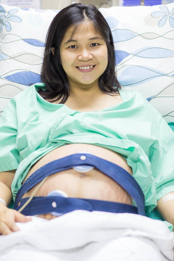 Pregnant women lying in hospital preparing for new baby, Hope concept