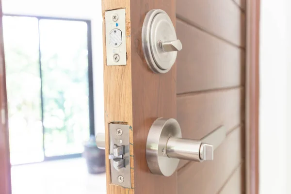 Modern knob dead lock on teak wooden door, Interior object