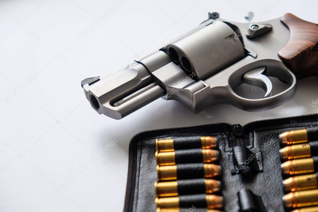 .44 magnum revolver gun with jacket soft point bulet on white background