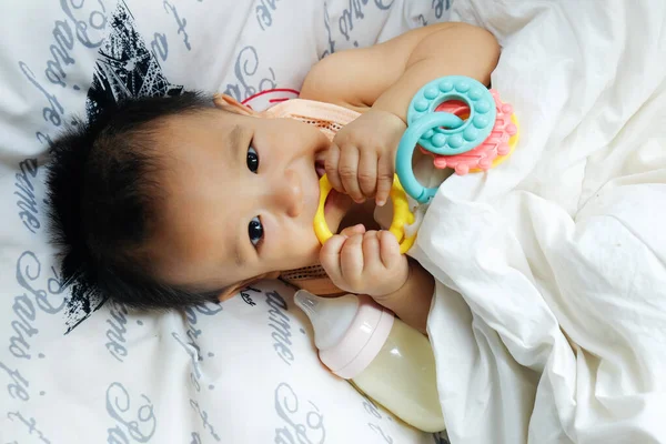 Asian Baby Boy Lying White Blanket Rubber Bite Look View — Stock Photo, Image