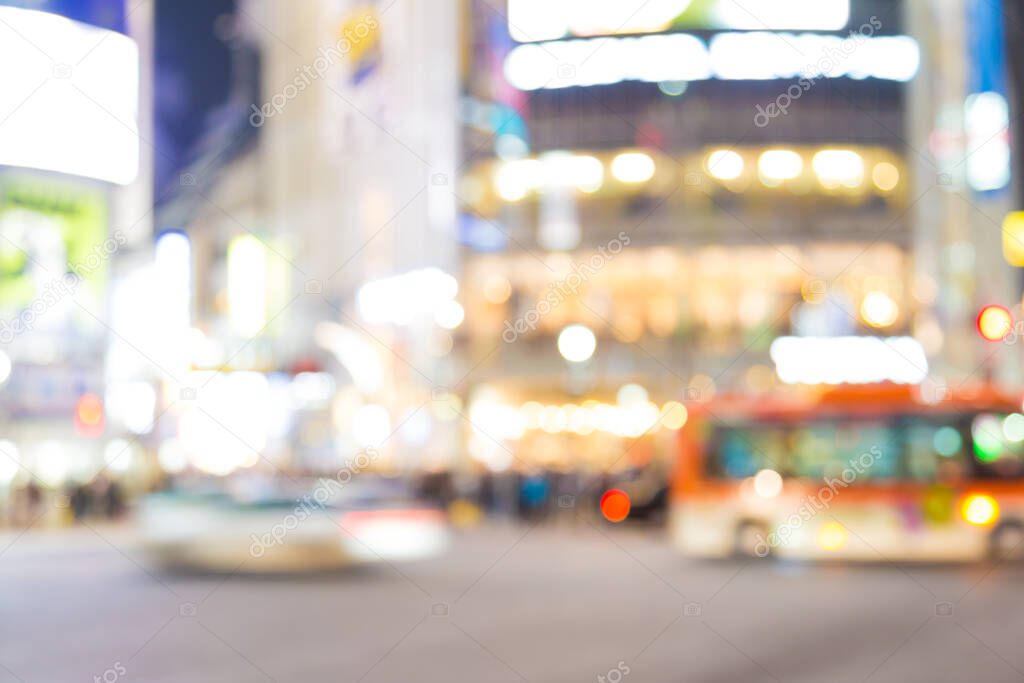 Blurred night traffic movement and people walking in Shibuya Tokyo town, Japan