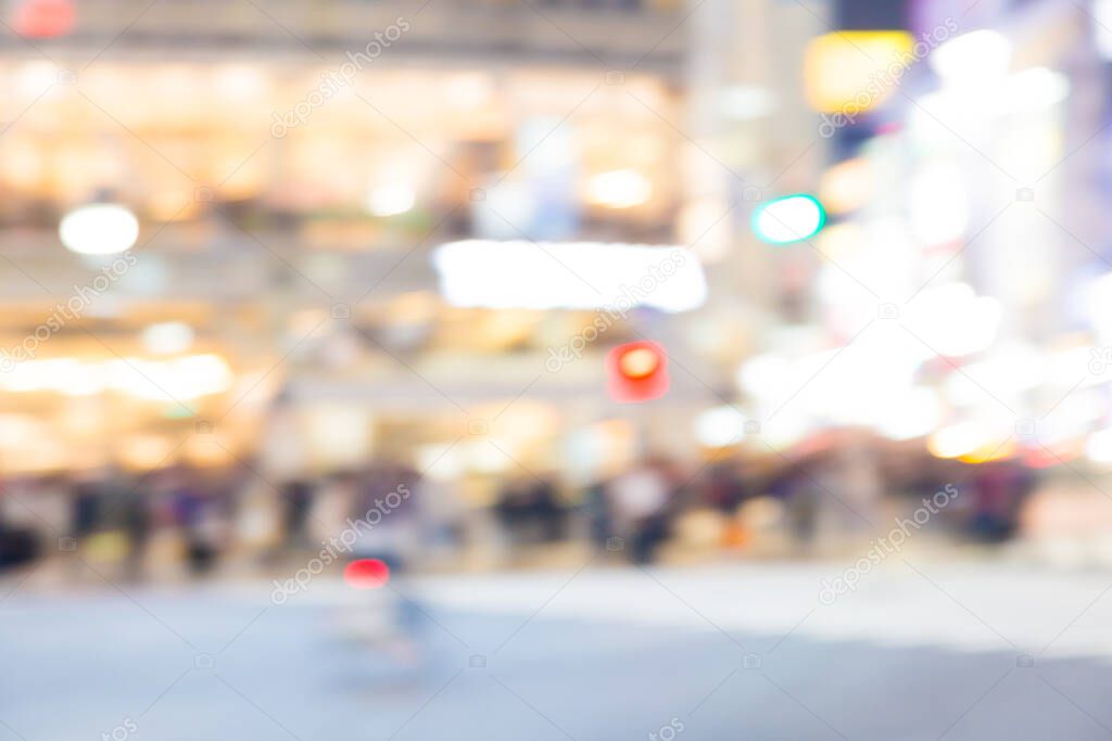 Blurred night traffic movement and people walking in Shibuya Tokyo town, Japan