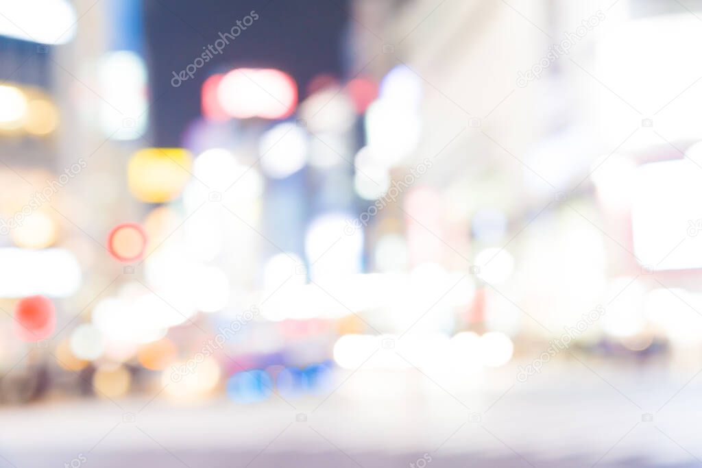 Blurred night traffic movement and people walking in Shibuya Tokyo town, Japan
