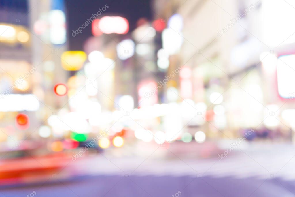 Blurred night traffic movement and people walking in Shibuya Tokyo town, Japan