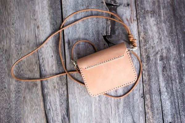 Vegetable tanned leather purse bag waist belt pocket on wood handmade bag