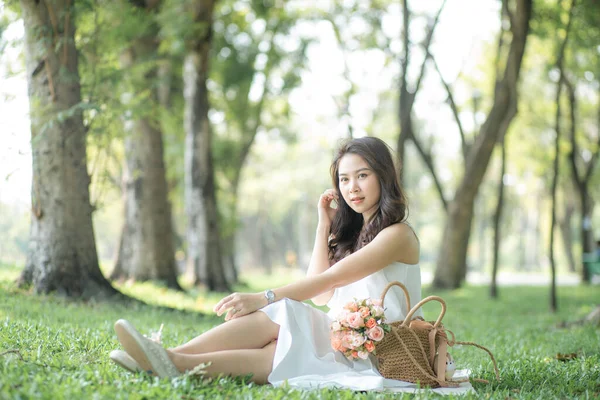 Attractive Asian Beautiful Women Sitting Green Grass Talking Smartphone City —  Fotos de Stock