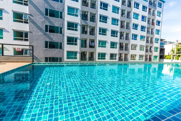 Modern condominium building with swimming pool blue sky, House and flat concept
