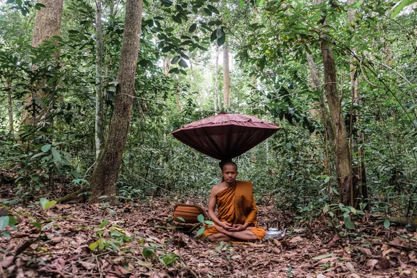 Buddist monk made meditation in deep forest religion concept