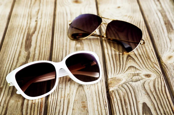 One white female sunglasses and one unisex sunglasses close-up o — Stock Photo, Image