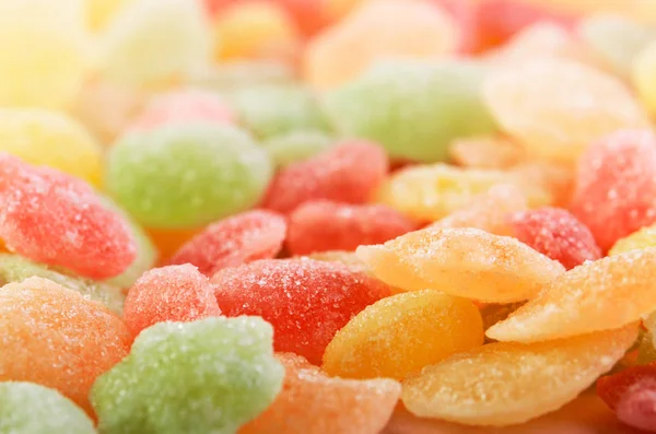 Many multicolored candies on a full background horizontal — Stock Photo, Image
