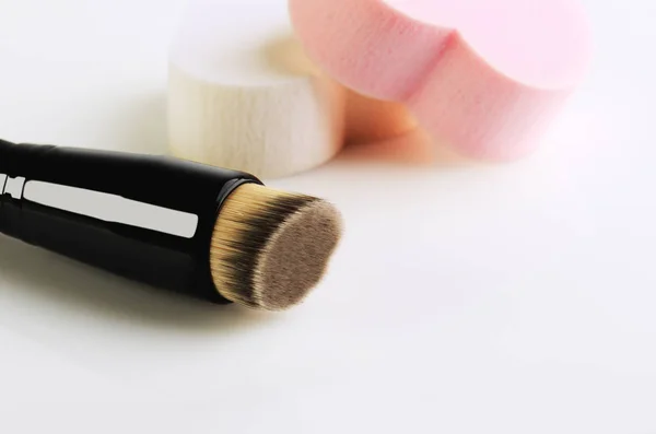 Make-up brush and sponges on a white background, space for text, — Stock Photo, Image